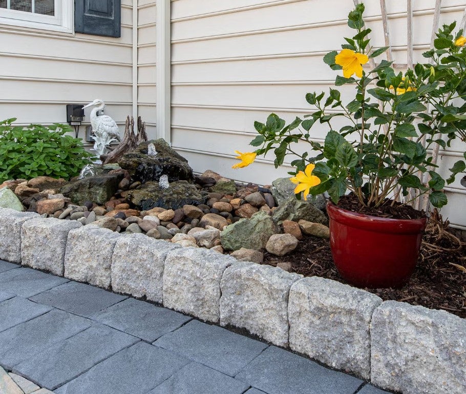 Stamped concrete patio with Tru-Scapes outdoor lighting and Belgard curb stones in South Jersey